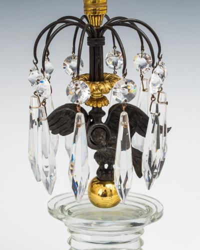 A FINE PAIR OF REGENCY EAGLE CANDLESTICKS