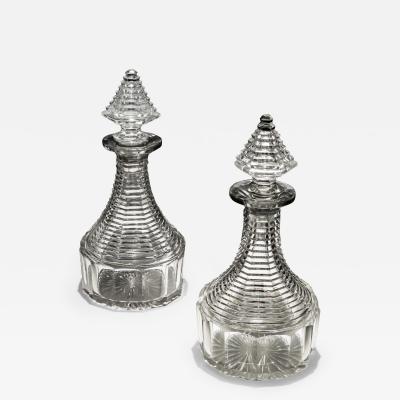 A FINE PAIR OF REGENCY STEP CUT SEMI SHIPS DECANTERS