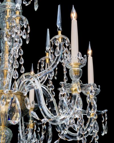 A FINE PAIR OF SIX LIGHT ORMOLU MOUNTED CUT GLASS ANTIQUE CHANDELIERS