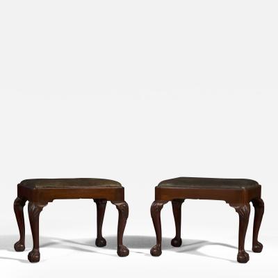 A FINE QUALITY PAIR OF EARLY GEORGIAN BALL AND CLAW HONDURAS MAHOGANY STOOLS