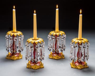 A FINE SET OF FOUR ROCKINGHAM PORCELAIN CANDLESTICKS