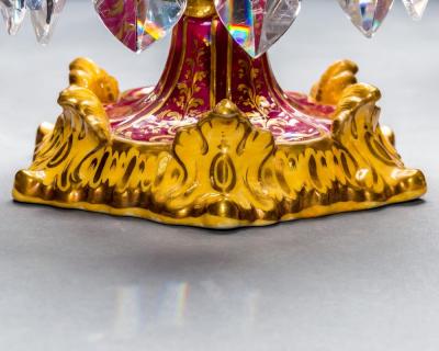 A FINE SET OF FOUR ROCKINGHAM PORCELAIN CANDLESTICKS