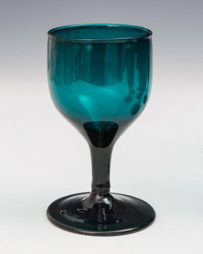 A FINE SET OF NINE REGENCY GREEN GLASSES