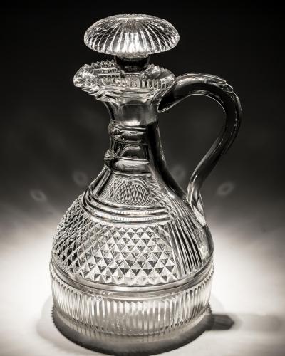 A FINELY CUT REGENCY SEMI SHIPS CLARET JUG