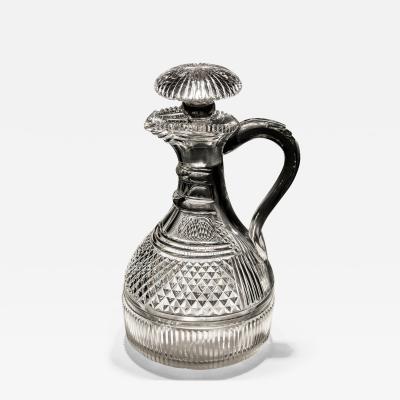 A FINELY CUT REGENCY SEMI SHIPS CLARET JUG