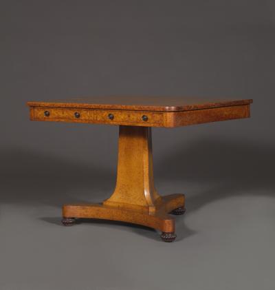 A Finely Figured Amboyna Late Regency Library Table