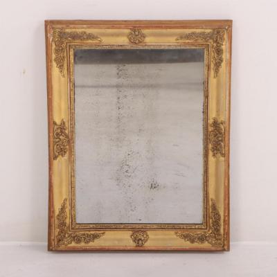 A French Empire small giltwood and gesso decorated mirror 19th C