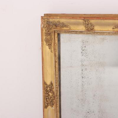 A French Empire small giltwood and gesso decorated mirror 19th C