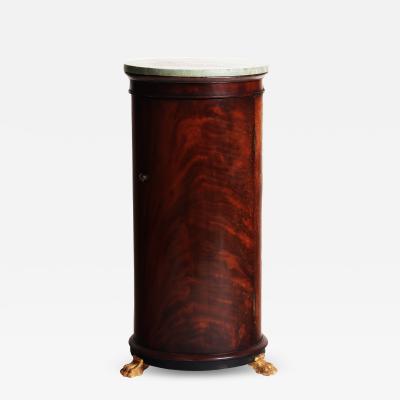 A French Empire style cylinder shaped somno mahogany pedestal bedside cabinet