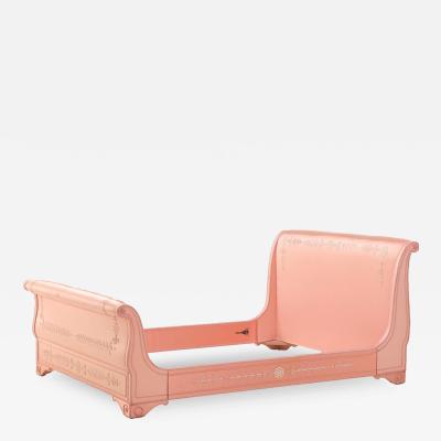 A French Empire style painted and upholstered full size sleigh bed 