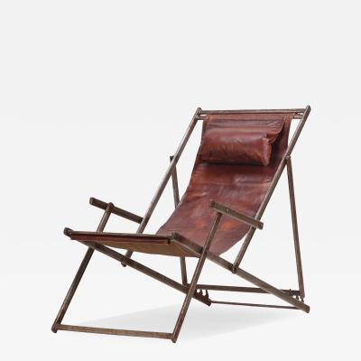 A French Folding Iron and Leather Lounge Chair C 1970 