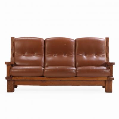 A French Heavy Oak Brutalist style Open Arm Sofa C 1960 