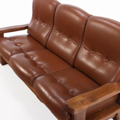 A French Heavy Oak Brutalist style Open Arm Sofa C 1960 