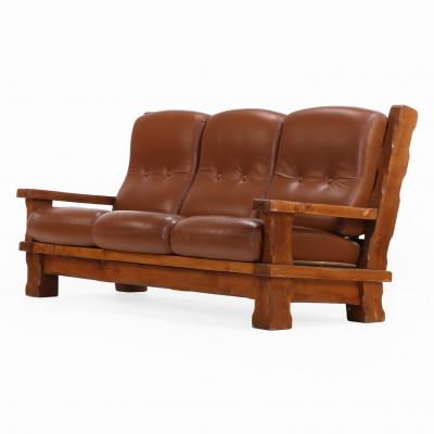 A French Heavy Oak Brutalist style Open Arm Sofa C 1960 