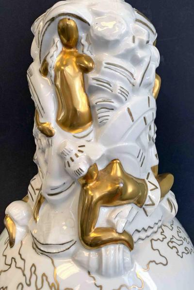 A French Lamp Base Art Deco figures around a globe 