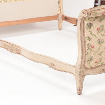 A French Louis XV style Queen size painted and carved bed circa 1950 