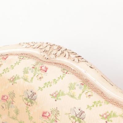 A French Louis XV style Queen size painted and carved bed circa 1950 