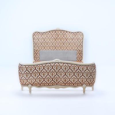 A French Louis XV style full size bed having a curved footboard C 1920