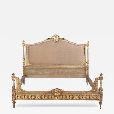 A French Louis XVI style Painted Gilded Queen Size Bed C 1910 