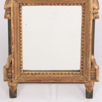 A French Louis XVI style carved and giltwood mirror C 1810 