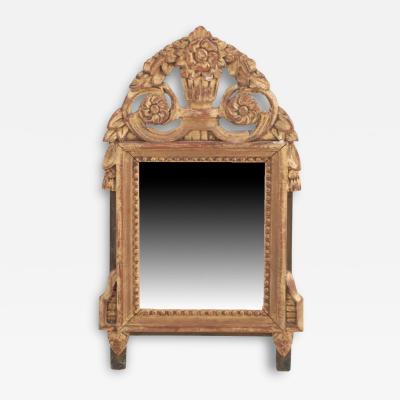 A French Louis XVI style carved and giltwood mirror C 1810 