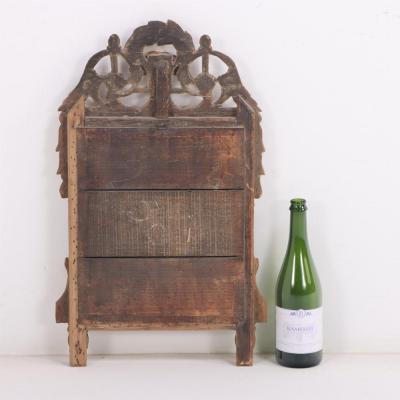 A French Louis XVI style carved and giltwood mirror C 1810 