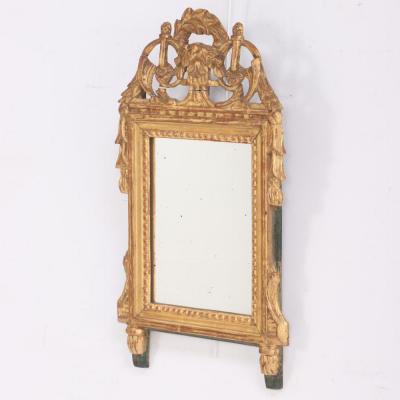 A French Louis XVI style carved and giltwood mirror C 1810 