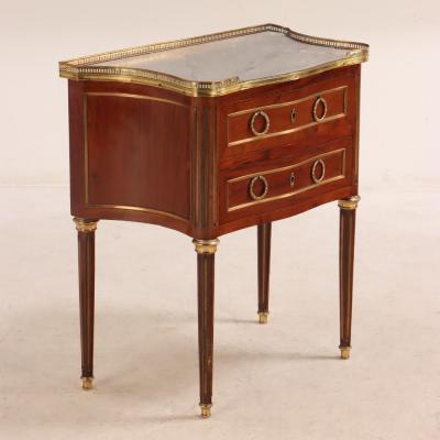 A French Louis XVI style mahogany petite marble top commode C 1910 
