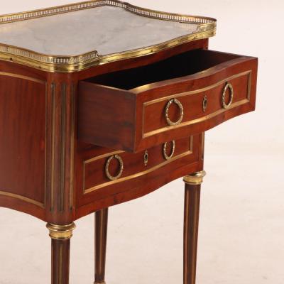 A French Louis XVI style mahogany petite marble top commode C 1910 