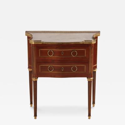 A French Louis XVI style mahogany petite marble top commode C 1910 