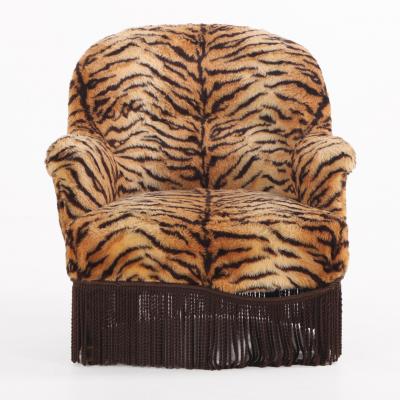 A French Lounge Chair covered in faux tiger fabric 19th C 