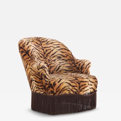 A French Lounge Chair covered in faux tiger fabric 19th C 