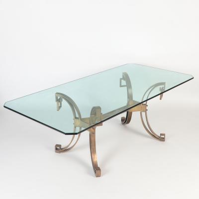 A French Modern Solid bronze dining table having a glass top C 1940 
