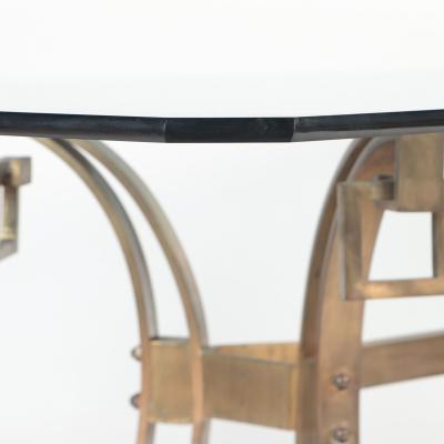 A French Modern Solid bronze dining table having a glass top C 1940 