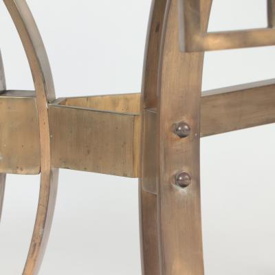 A French Modern Solid bronze dining table having a glass top C 1940 