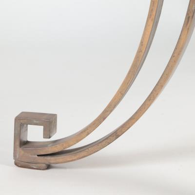 A French Modern Solid bronze dining table having a glass top C 1940 