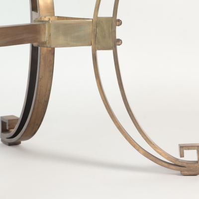 A French Modern Solid bronze dining table having a glass top C 1940 