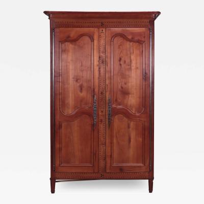 A French cherry armoire with inlay circa 1800 