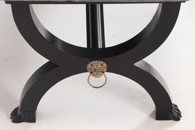 A French ebonized Empire style marble top coffee table with bronze mounts 