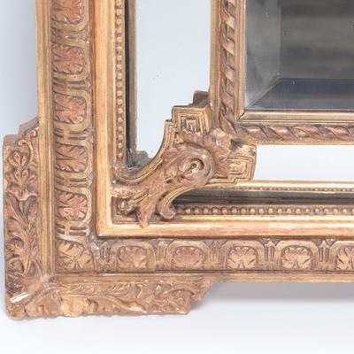 A French gilt wood and gesso mirror with mirrored border Circa 1900 