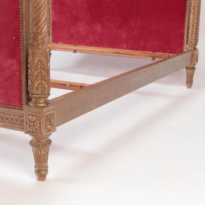 A French giltwood Louis XVI style full size bed C 1900 