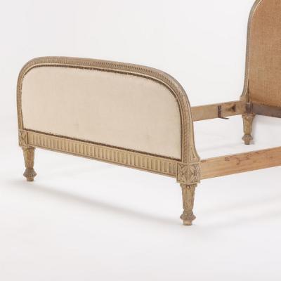 A French painted and carved full size bed in the Regency style C 1900 