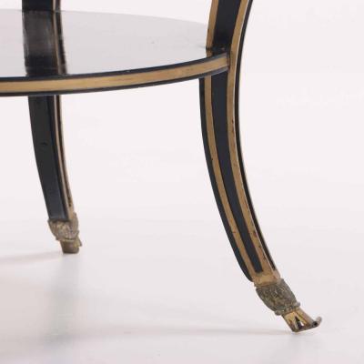 A French round marble top ebonized and gilt table C 1940 