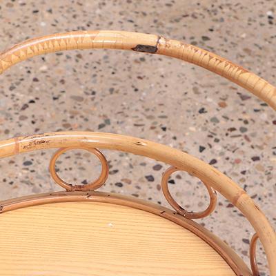 A French two tier rattan bar cart on wheels Circa 1960