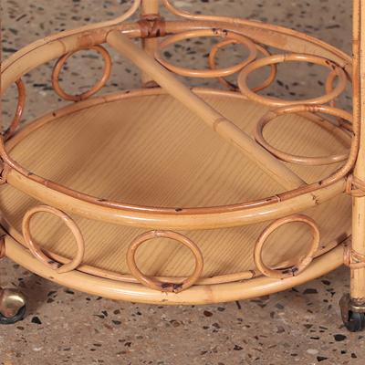 A French two tier rattan bar cart on wheels Circa 1960