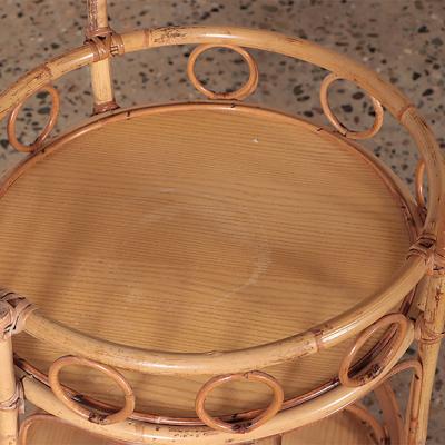 A French two tier rattan bar cart on wheels Circa 1960