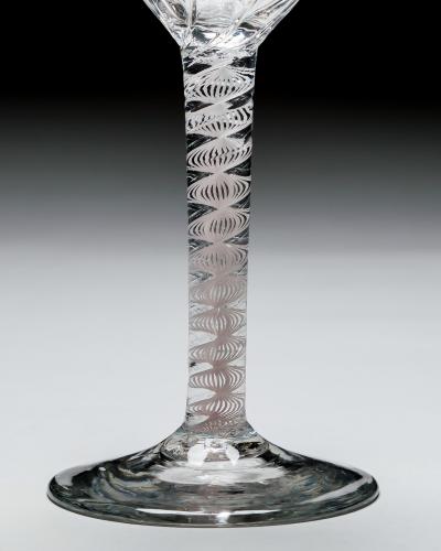 A GENEROUS PANEL MOULDED OPAQUE TWIST WINE GLASS