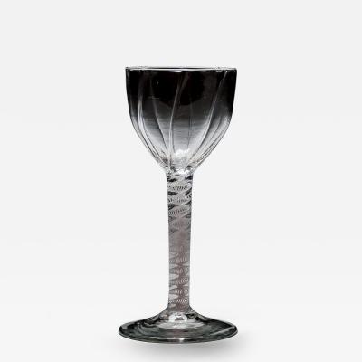 A GENEROUS PANEL MOULDED OPAQUE TWIST WINE GLASS