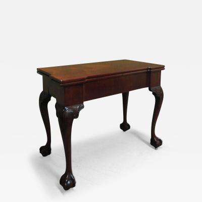 A GEORGE II MAHOGANY GAMES TABLE