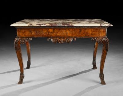 A GEORGE II PERIOD CARVED WALNUT SIDE TABLE